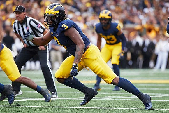 Rashan Gary (3) and David Long (22)