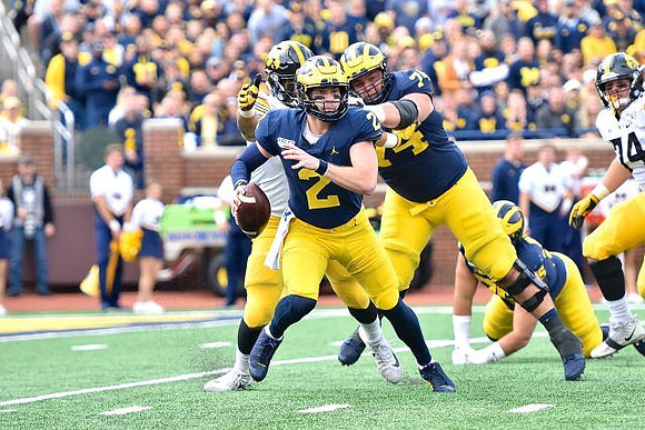 Shea Patterson (2), Sean McKeon (84), and Jon Runyan Jr. (75)