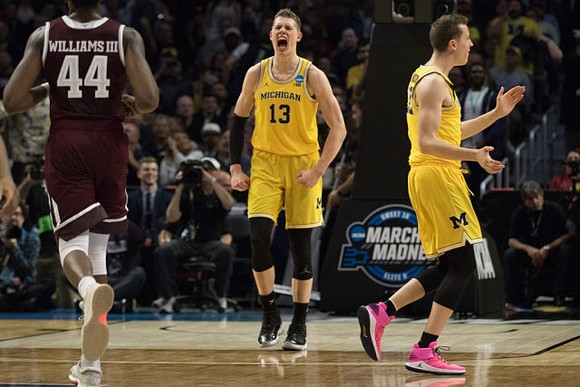 Moritz Wagner (13) and Duncan Robinson (22)
