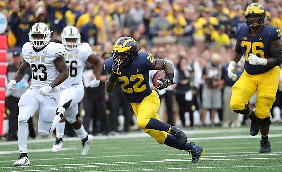 Karan Higdon (22) and Juwann Bushell-Beatty (76)