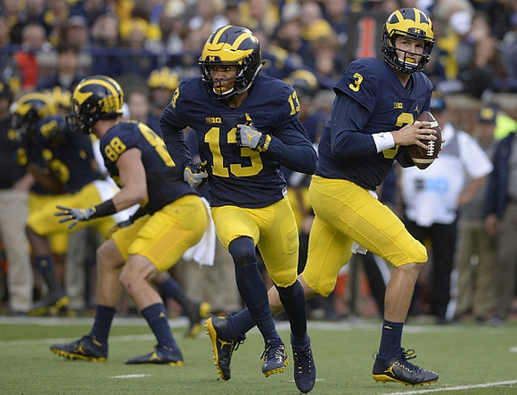 Jake Butt (88), Eddie McDoom (13), and Wilton Speight (3)
