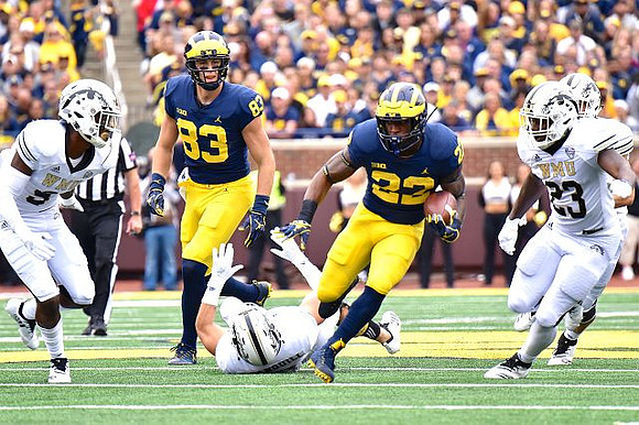 Zach Gentry (83) and Karan Higdon (22)