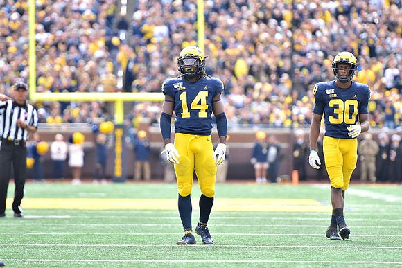 Josh Metellus (14) and Daxton Hill (30)