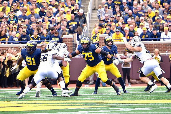 Cesar Ruiz (51), Jon Runyan Jr. (75), and Shea Patterson (2)