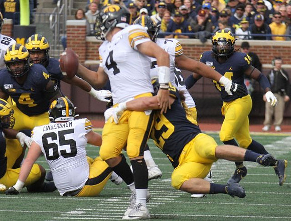 Michael Danna (4), Jordan Glasgow (29), and Josh Metellus (14)