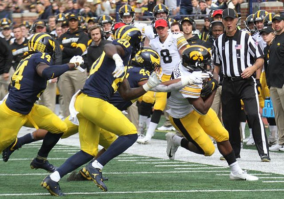 Josh Metellus (14), Brad Hawkins (20), and Cameron McGrone (44)
