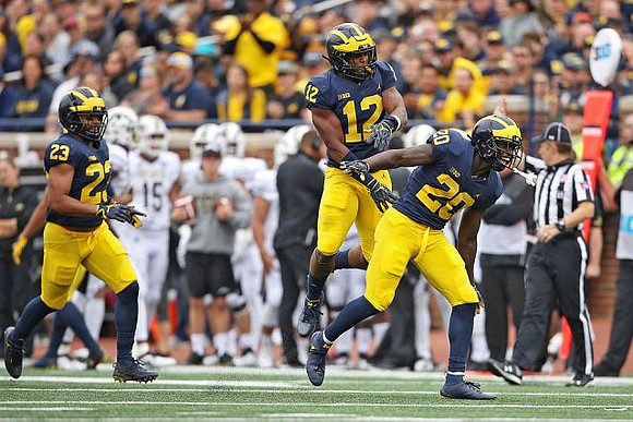 Tyree Kinnel (23), Josh Ross (12), and Brad Hawkins (20)