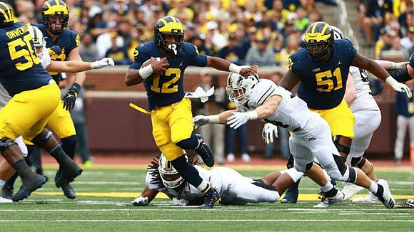 Michael Onwenu (50), Zach Gentry (83), Chris Evans (12), and Cesar Ruiz (51)