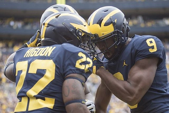 Karan Higdon (22) and Donovan Peoples-Jones (9)