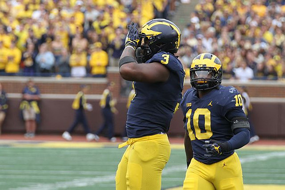 Rashan Gary (3) and Devin Bush (10)
