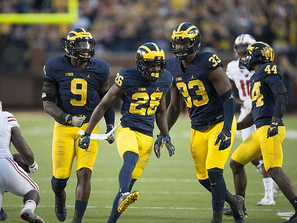Mike McCray (9), Jourdan Lewis (26), Taco Charlton (33), and Delano Hill (44)