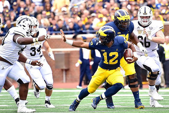 Chris Evans (12) and Cesar Ruiz (51)