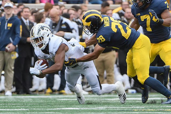 Brandon Watson (28) and Khaleke Hudson (7)
