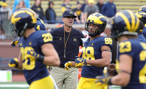 Ben VanSumeren (20), Jim Harbaugh, Grant Perry (88), and O'Maury Samuels (23)