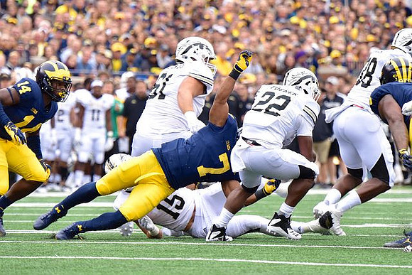Josh Metellus (14) and Khaleke Hudson (7)