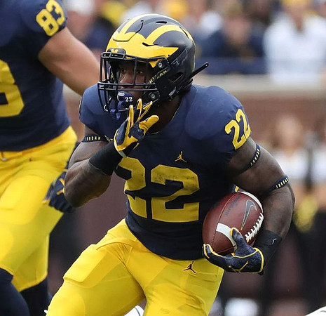 Zach Gentry (83) and Karan Higdon (22)