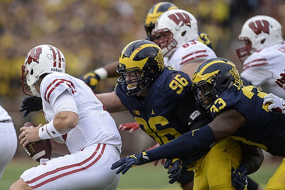 Ryan Glasgow (96) and Taco Charlton (33)