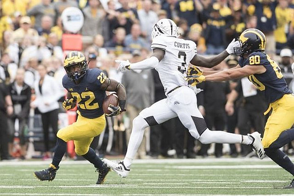 Karan Higdon (22) and Oliver Martin (80)