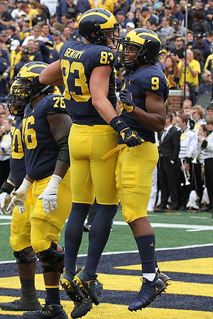 Michael Onwenu (50), Juwann Bushell-Beatty (76), Zach Gentry (83), and Donovan Peoples-Jones (9)