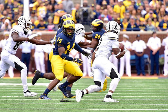Josh Metellus (14) and Lavert Hill (24)