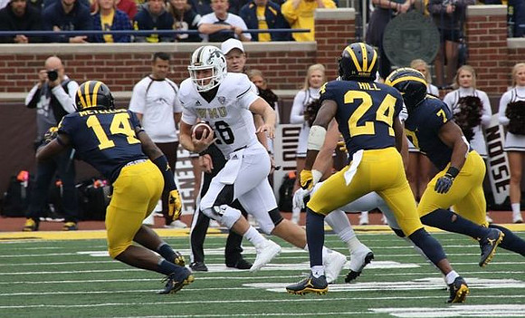 Josh Metellus (14), Lavert Hill (24), and Khaleke Hudson (7)