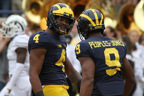 Ryan Nelson (40) and Donovan Peoples-Jones (9)