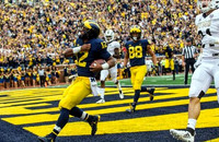 Karan Higdon (22) and Grant Perry (88)