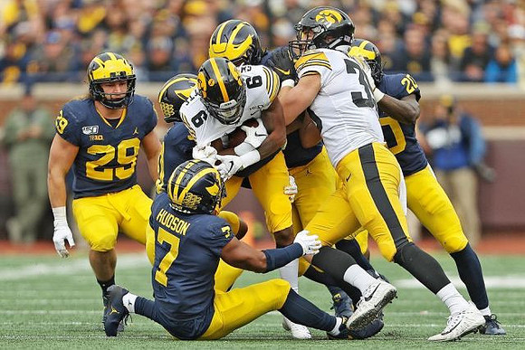 Jordan Glasgow (29), Daxton Hill (30), Khaleke Hudson (7), and Brad Hawkins (20)