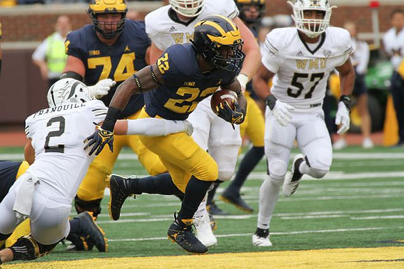 Karan Higdon (22) and Ben Bredeson (74)