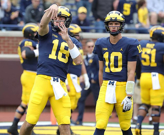 Brandon Peters (18), Dylan McCaffrey (10), and Cesar Ruiz (51)