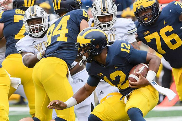 Chris Evans (12), Ben Bredeson (74), Sean McKeon (84), and Juwann Bushell-Beatty (76)
