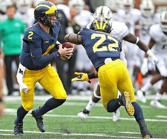 Shea Patterson (2) and Karan Higdon (22)