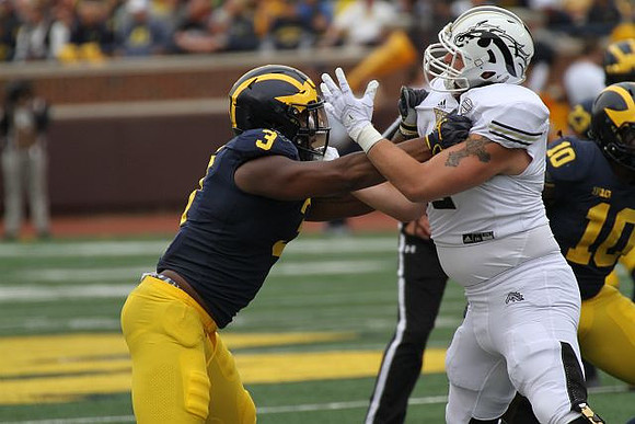 Rashan Gary (3) and Devin Bush (10)