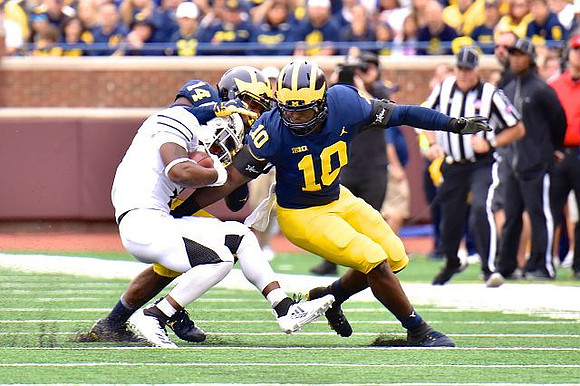 Devin Bush (10) and Josh Metellus (14)