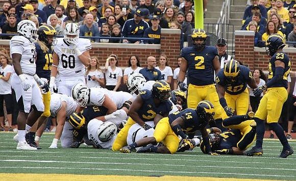 Chase Winovich (15), Devin Bush (10), Rashan Gary (3), Josh Metellus (14), Carlo Kemp (2), Josh Ross (12), and Tyree Kinnel (23)
