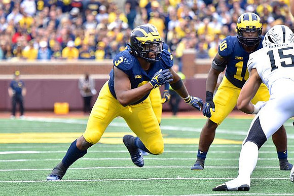 Rashan Gary (3) and Devin Bush (10)