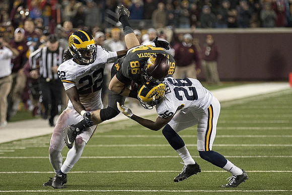 Jarrod Wilson (22) and Jourdan Lewis (26)