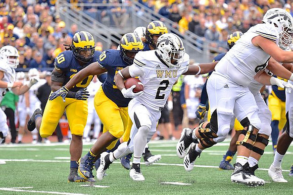 Devin Bush (10) and Michael Dwumfour (50)