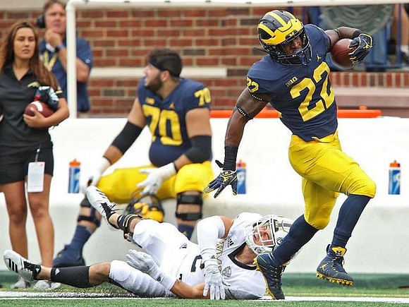Nolan Ulizio (70) and Karan Higdon (22)