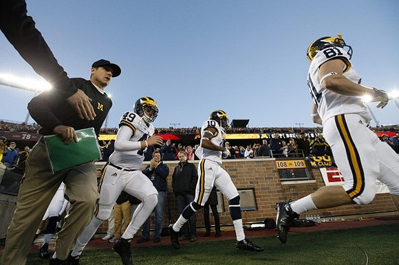 Jim Harbaugh, Anthony Dalimonte (49), Da'Mario Jones (10), and Michael Jocz (81)