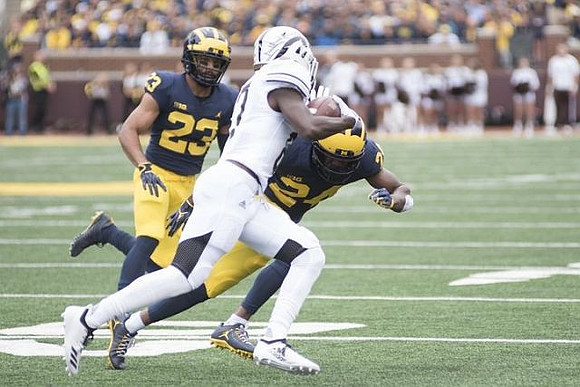 Tyree Kinnel (23) and Lavert Hill (24)