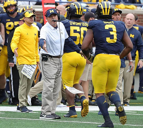 Don Brown, Michael Dwumfour (50), and Rashan Gary (3)