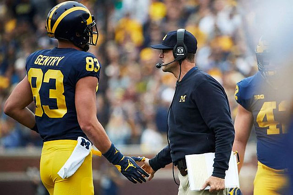 Zach Gentry (83), Jim Harbaugh, and Ben Mason (42)