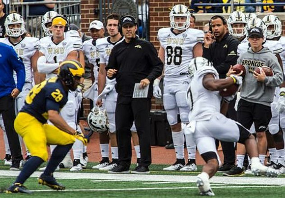 Brandon Watson (28) and Western Michigan Head Coach Tim Lester
