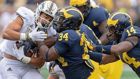 Jordan Anthony (34) and Josh Metellus (14)