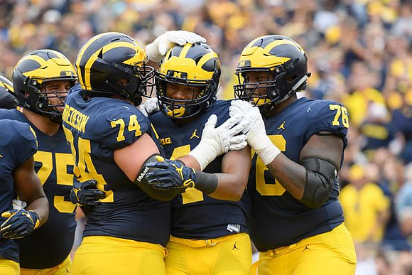Jon Runyan Jr. (75), Ben Bredeson (74), Nico Collins (4), and Juwann Bushell-Beatty (76)
