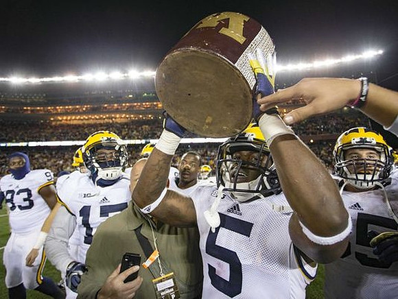 Lawrence Marshall (93), Freddy Canteen (17), Jabrill Peppers (5), Joe Bolden (35), and The Little Brown Jug