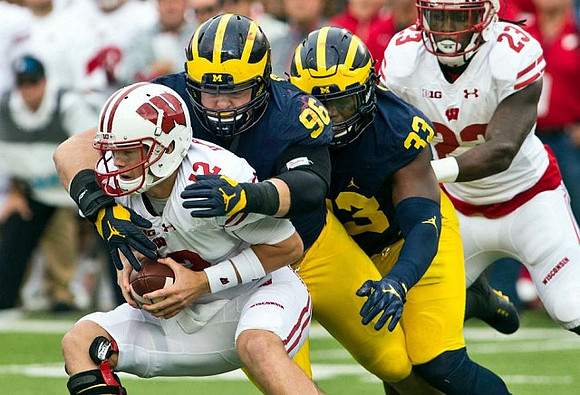 Ryan Glasgow (96) and Taco Charlton (33)