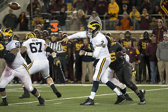 Mason Cole (52), Kyle Kalis (67), and Wilton Speight (3)