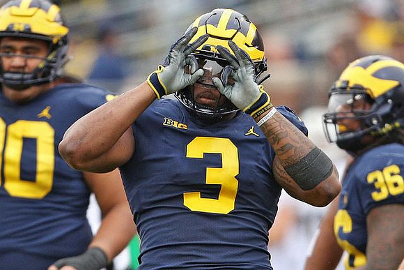 Bryan Mone (90), Rashan Gary (3), and Devin Gil (36)